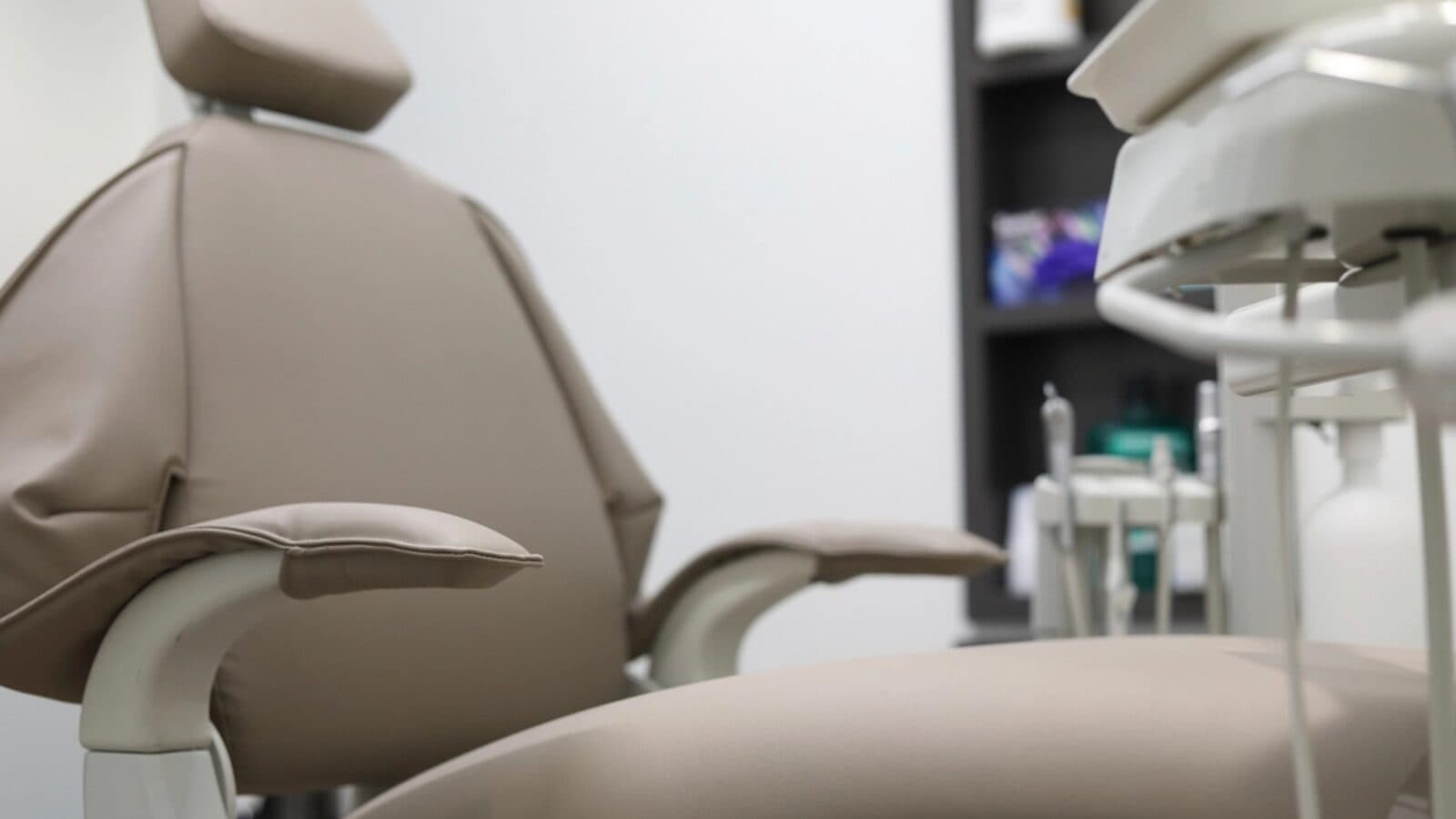 A modern dental chair in a bright treatment room